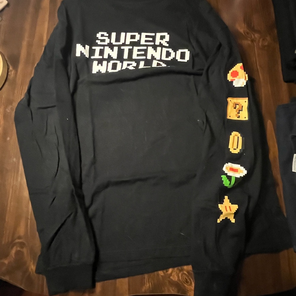 Universal Black Crewneck Sweater with Iconic Graphics
